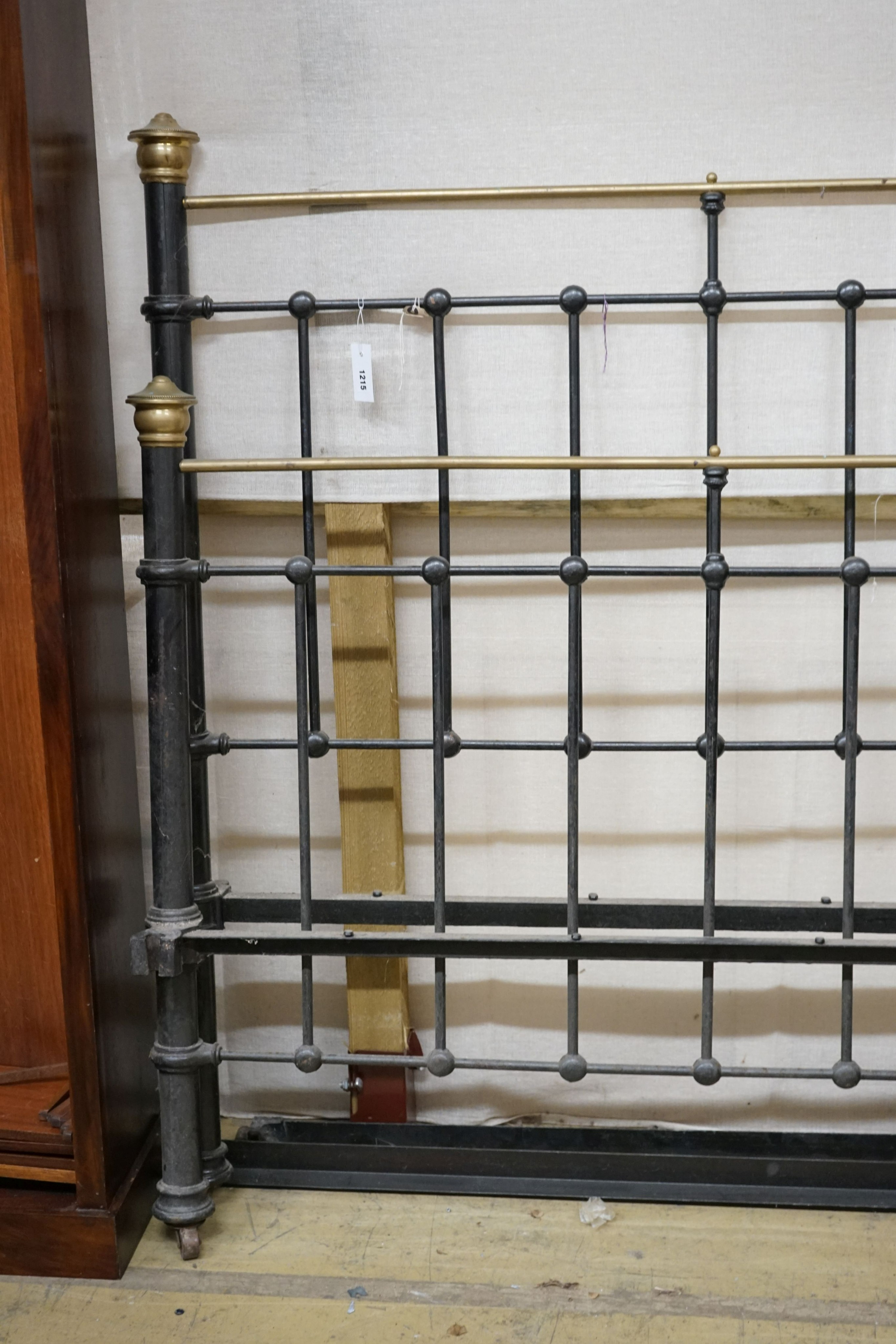A Victorian style iron and brass double bed frame, width 136cm